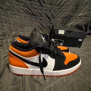Orange low top Jordan 1s
